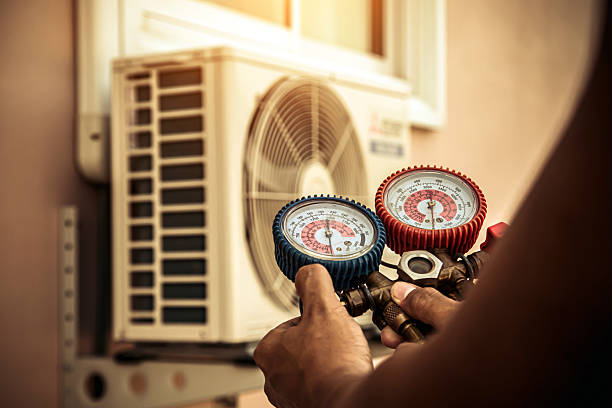 Professional Hvac technician working in Montevallo, AL
